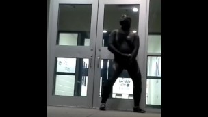 lubed rubber man cums in front of doors