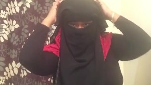 Lonely Niqabi Hijabi woman sucking dildo & shaking ass