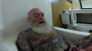 Inked Daddy Bear Stroking and Pissing in Hotel