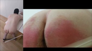 Guy's ass whipped hard by machine with plastic strip