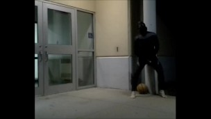 barefoot frogman cums inside a condom in front of hotel doors