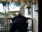 Fat men sitting outside happy 10/16