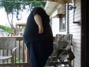 Fat men sitting outside happy 7/16