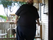 Fat men sitting outside happy 8/16