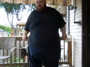 Fat men sitting outside happy 9/16