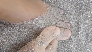 Rubbing feet in the sand