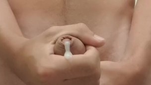 Fit boy jerks off with two hands