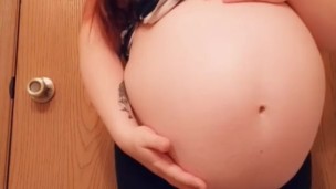 Tiny mama gives a sneak peak of her unborn while baby daddy showers