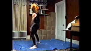 wearing black tights & crop top, stocking mask & wig hump air pillow 1990's
