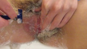 Shaving off my extreme hairy big clit pussy lips in close up