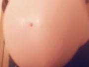 Big swollen pregnant belly with a beautiful princess inside