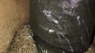 Close-Up Ebony Shoving 9” Dildo in Hairy Pussy