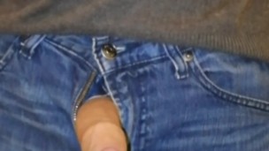 Uncircumsized cock taken out of jeans and stroked