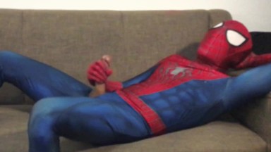 Horny Spiderman jerks off and cums massive load