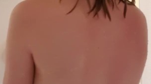 Teen soaps up tits in shower, finishes on floor