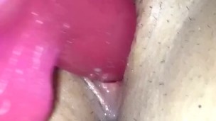 Pink dildo in wet pussy