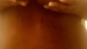 Sexy ebony playing with her tits