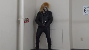masked leather man quickly shoots his load in hotel stairway