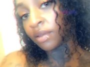 Sexy ebony massages her pussy