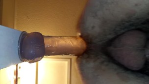 Watch my hairy ass swallow the monster dildo balls deep and loving it!