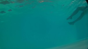Underwater swimming with jockstrap in hotel pool