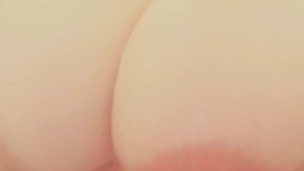 Playing with large, natural breasts in the shower