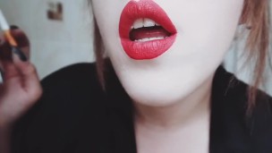 MISTRESS WITH LUSCIOUS RED LIPS CLOSE-UP SMOKING CIGARETTE