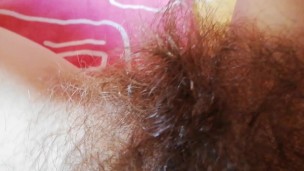 Playing with my thick hairy bush big clit pussy close up