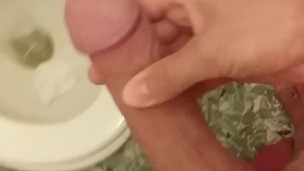 Playing with dick in toilet