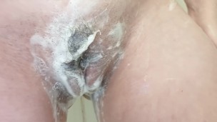 Rubbing my swollen pussy in the shower