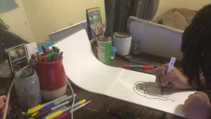 Young black male draws breast.