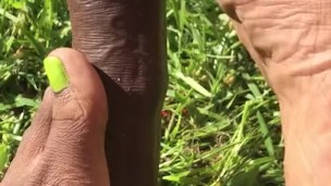 Singing toes on uncut dildo