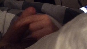 Close up POV handjob from wife in bed while she plays on her smartphone