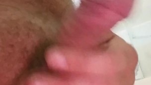 White cock piss into shower