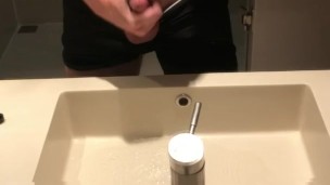 Blasting a load on hotel mirror