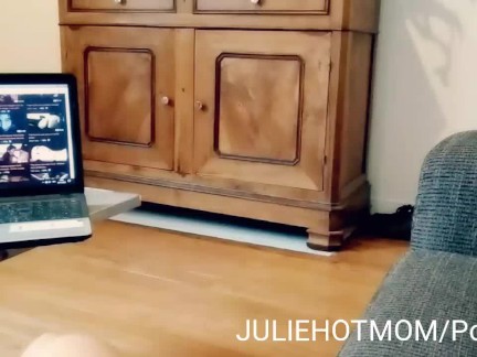 stepmother surprises her stepson and sucks his cock in front of a porn movie