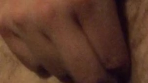 Deep fingering my tight hairy arsehole as I lay down on my bed at home