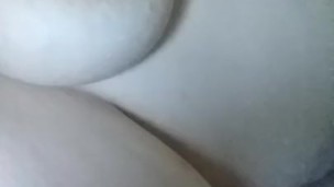 In bed playing with my tits