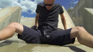 Pissing black athletic shorts in public and cumming inside them