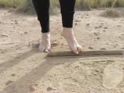 Super slow motion feet walking on dusty ground -- DIRTY FEET