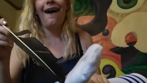 Hot blonde teases with socked feet and then tickles herself