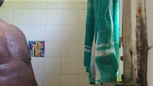 In the shower playing with my thick black cock