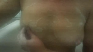 Playing with my pierced nipples in bathtubs