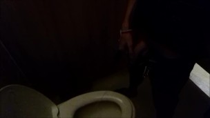 Guy pisses in a public toilet