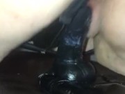 Riding a black dildo