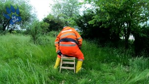 Riding dino toy in garden wearing hivis and rubber boots