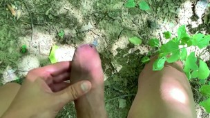 Public cumshot into hole on a ground outdoor