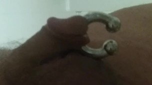 male pissing with large cockring