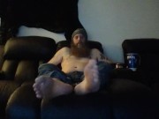 Bob hanging out barefoot in jeans