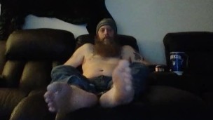 Bob hanging out barefoot in jeans